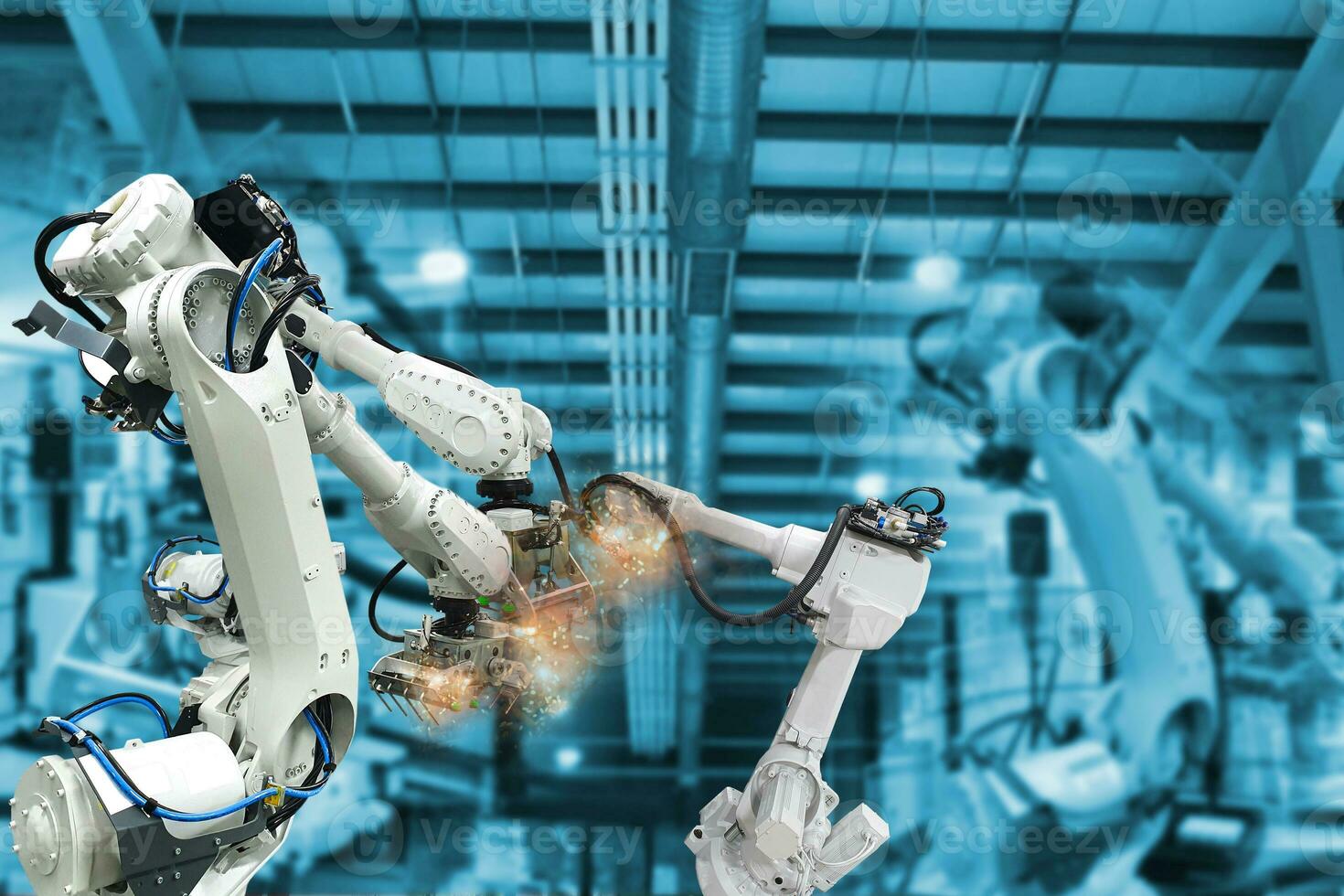 Robotic arms, industrial robots, factory automation machines photo