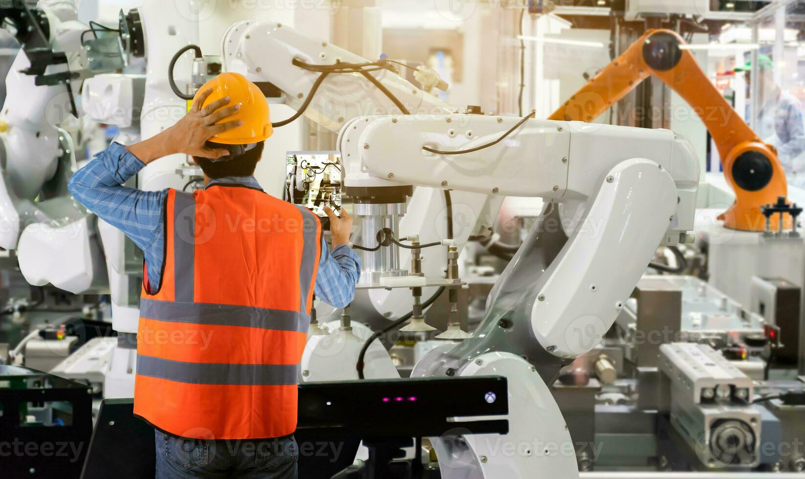 Engineering controlling machinery and industrial robots of things technology man using for control photo