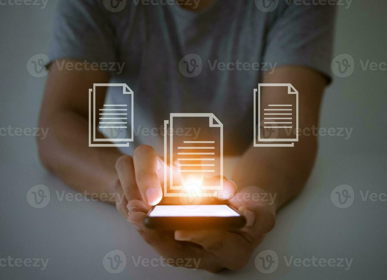 Document Management System concept A man with a smartphone social and a touch screen monitor photo