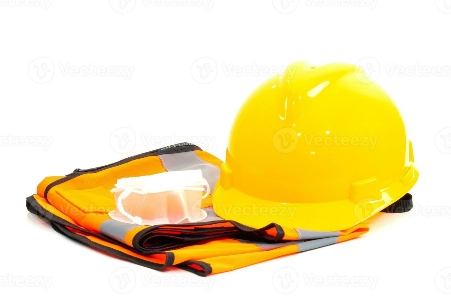 Yellow helmet an orange shirt and dust mask industry on a white background photo