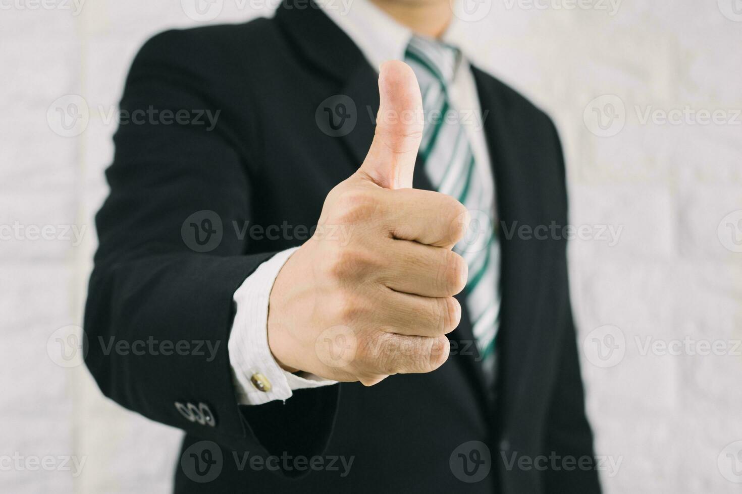 Business man thumbs up like Is excellent photo