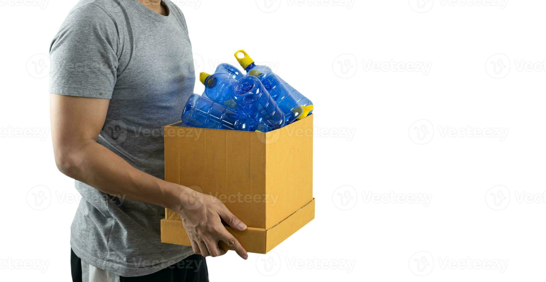 A man carrying a box with a plastic bottle to be recycled photo