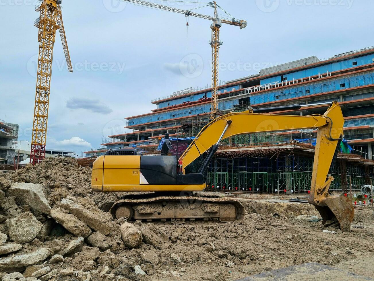 Backhoe on the building site the industrial construction photo