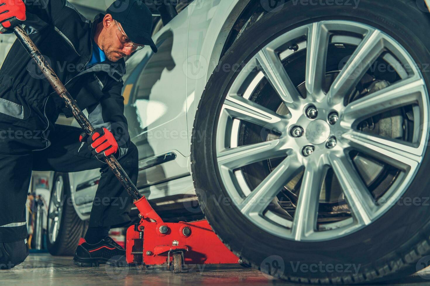 Mechanic with Floor Jack Lift photo