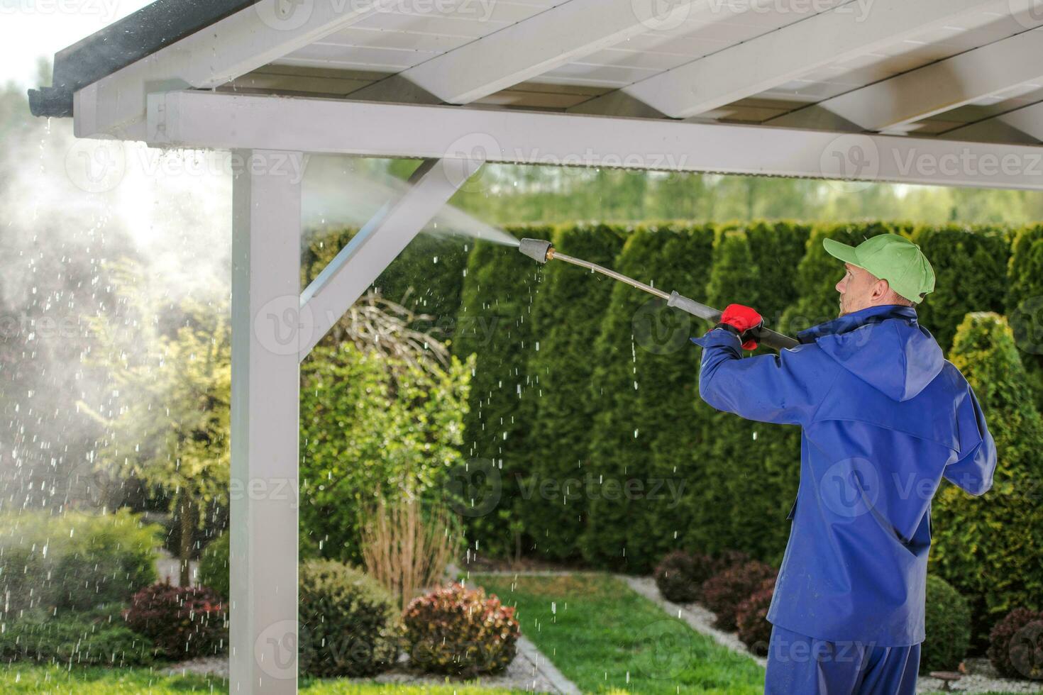 Men Pressure Washing Garden Porch Wooden Roof photo