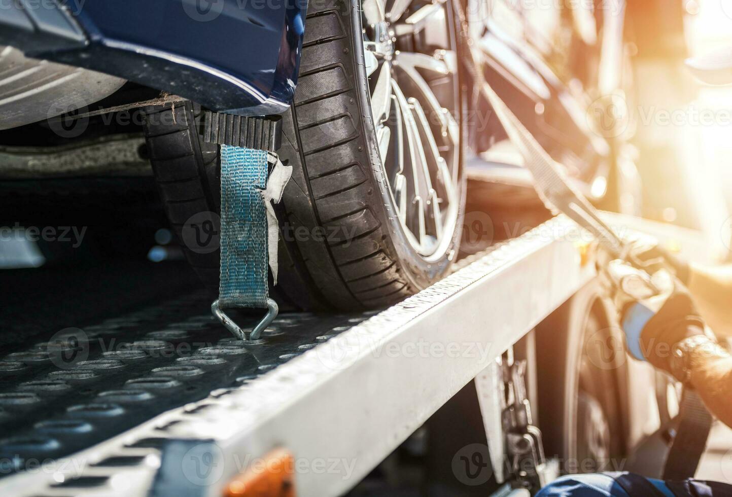 Car Safely Fastened on Towing Truck photo