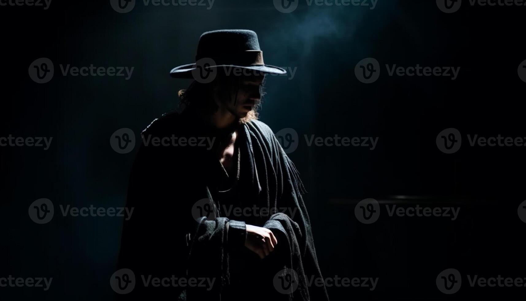 Dark elegance one man in black hood photo