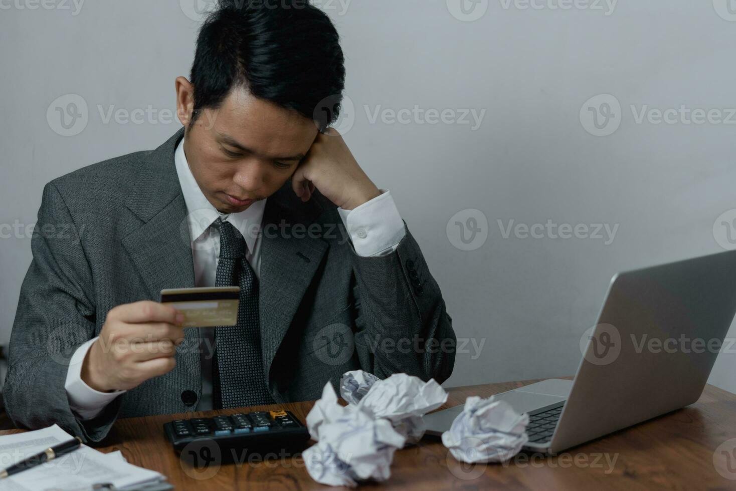 Worried Businessman asian Dealing with Credit Card Debt and Financial Problems checking wallet and credit card statements. Business banking , payment shopping and saving money concept. photo