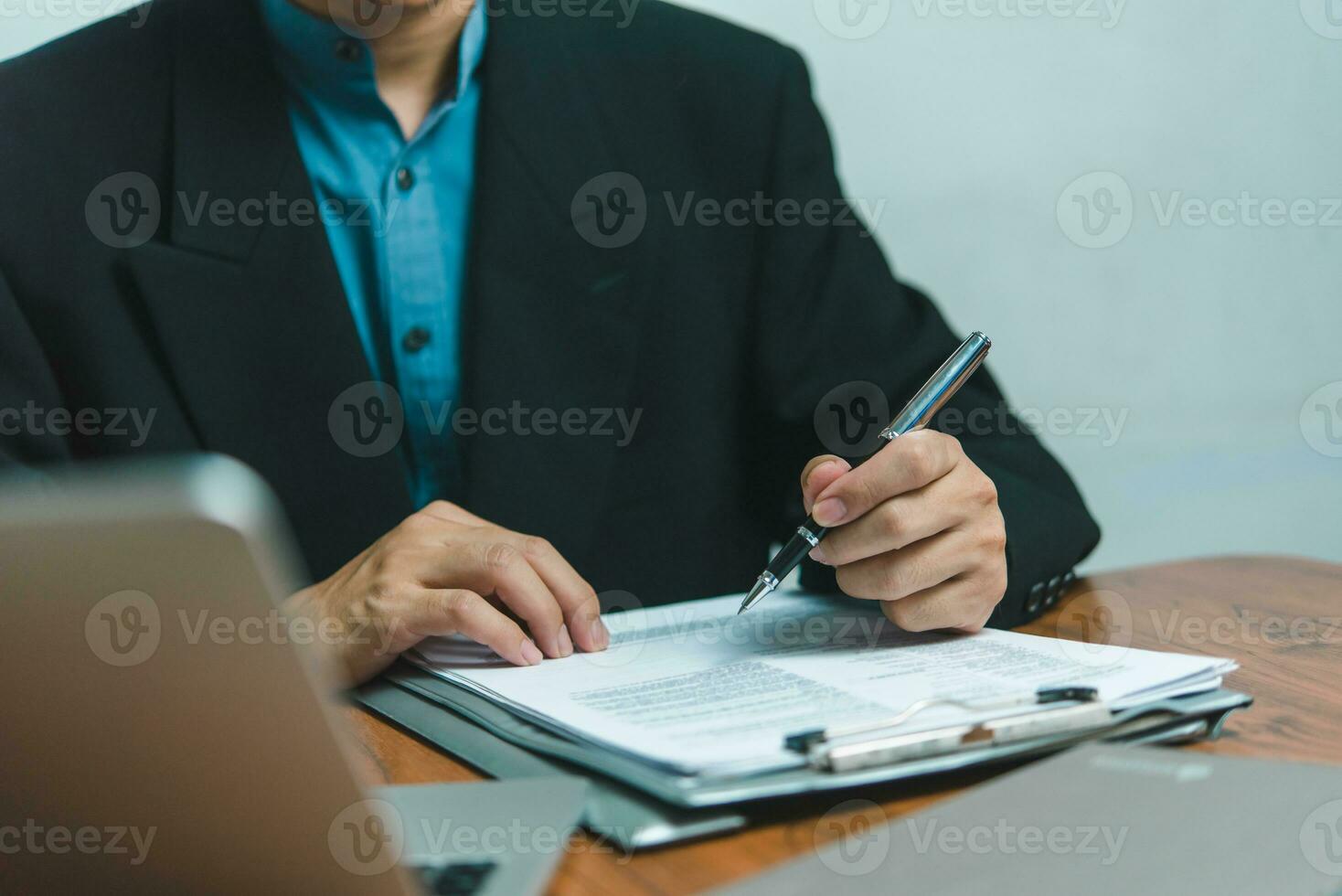 businessman agree to make deal signing document, sale contract, employment job or legal transaction contract at desk photo