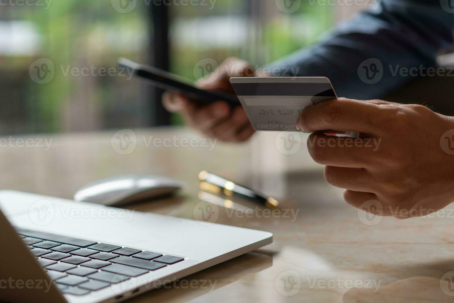 man hands holding credit card using internet payment laptop computer, online shopping digital banking, Business financial technology concept. photo