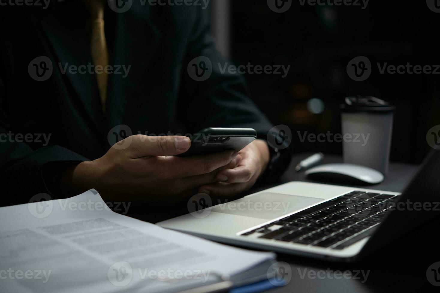 Businessman Checking Business Documents on Phone and Computer. Business concept report marketing and strategy working finance, accounting and tax, job application history. photo