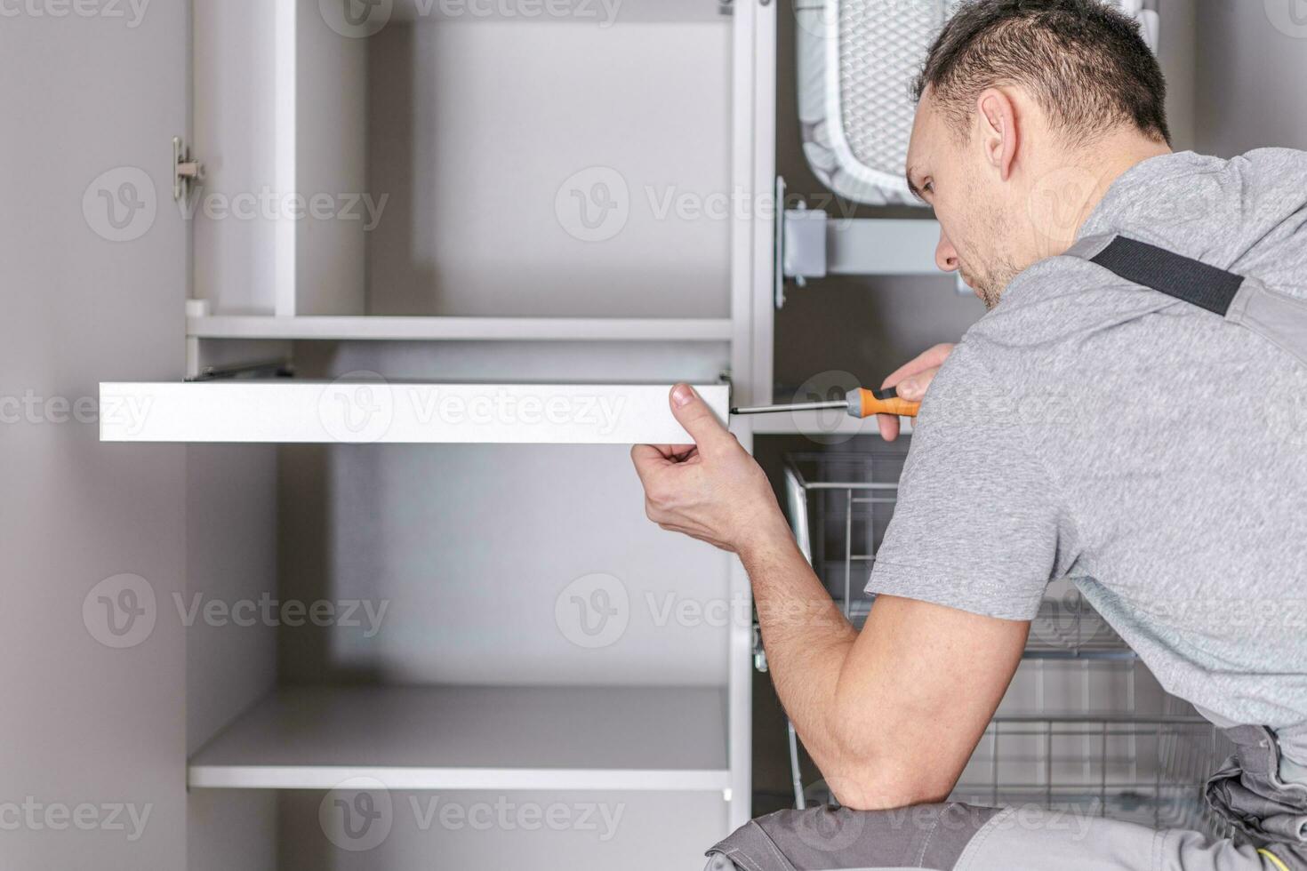 Men Assembling Cabinets photo