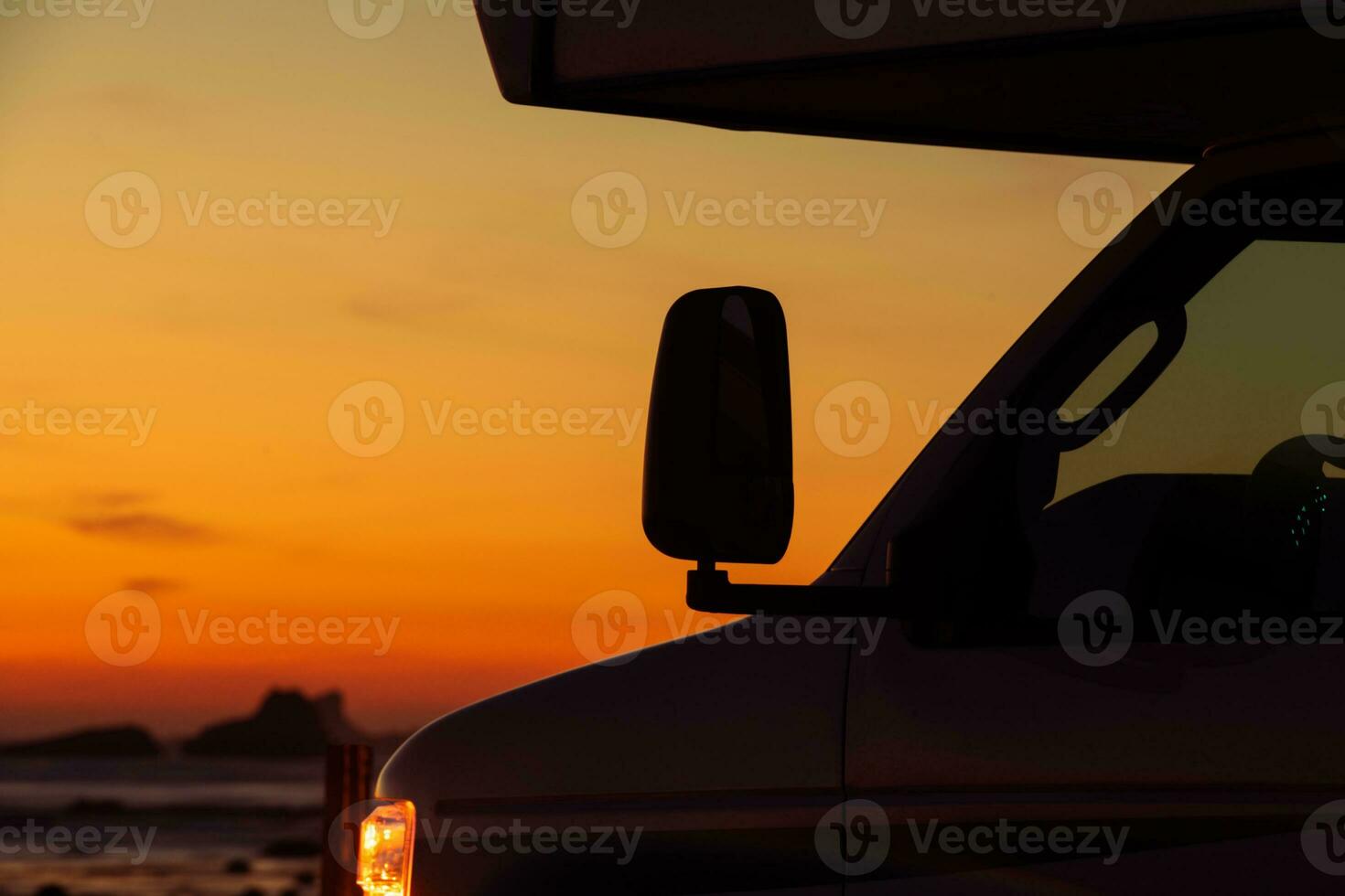 RV Road Trip Recreational Vehicle with Overhead Bunk and Scenic Sunset Vista photo