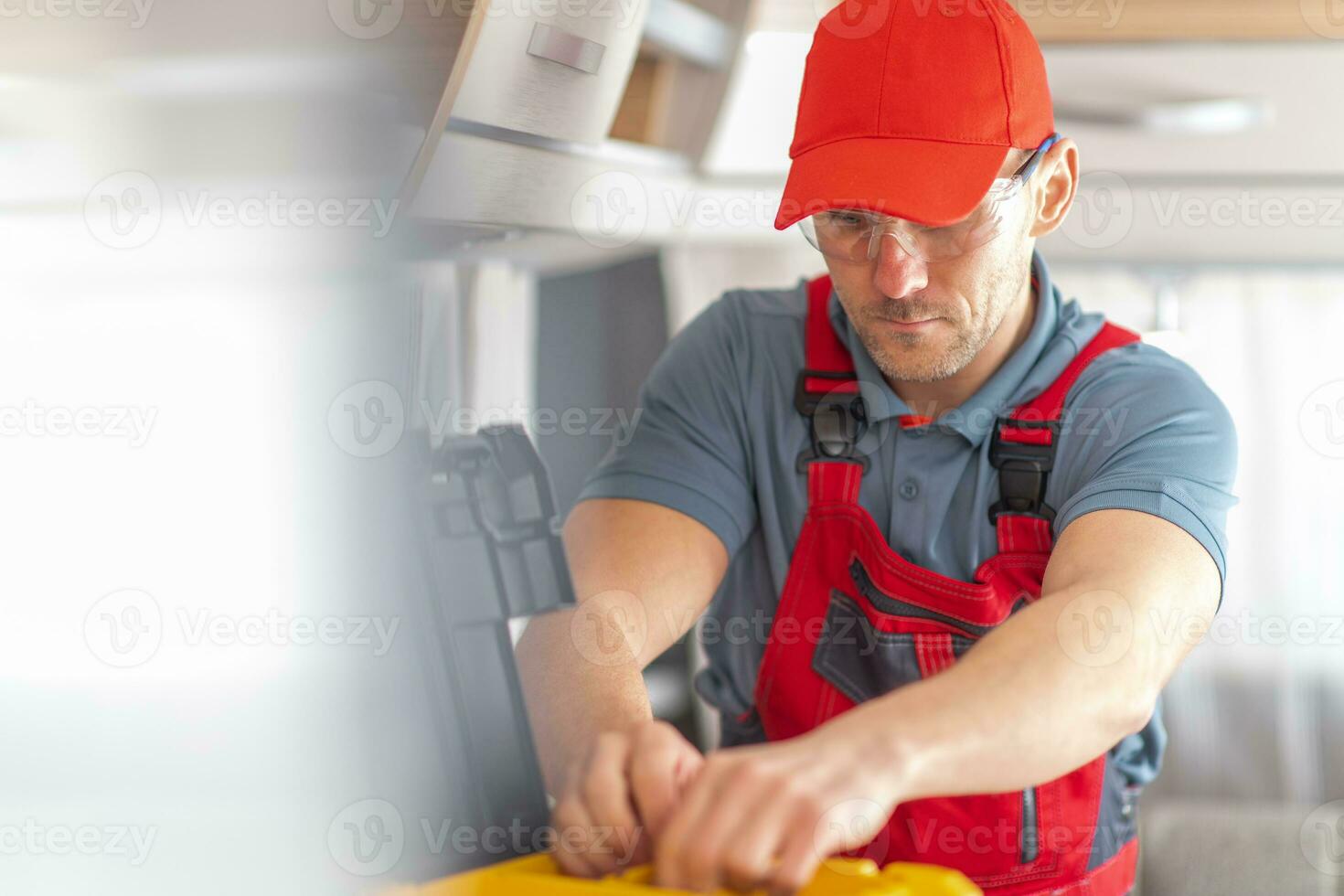 RV Industry Technician Inside Modern Travel Trailer photo