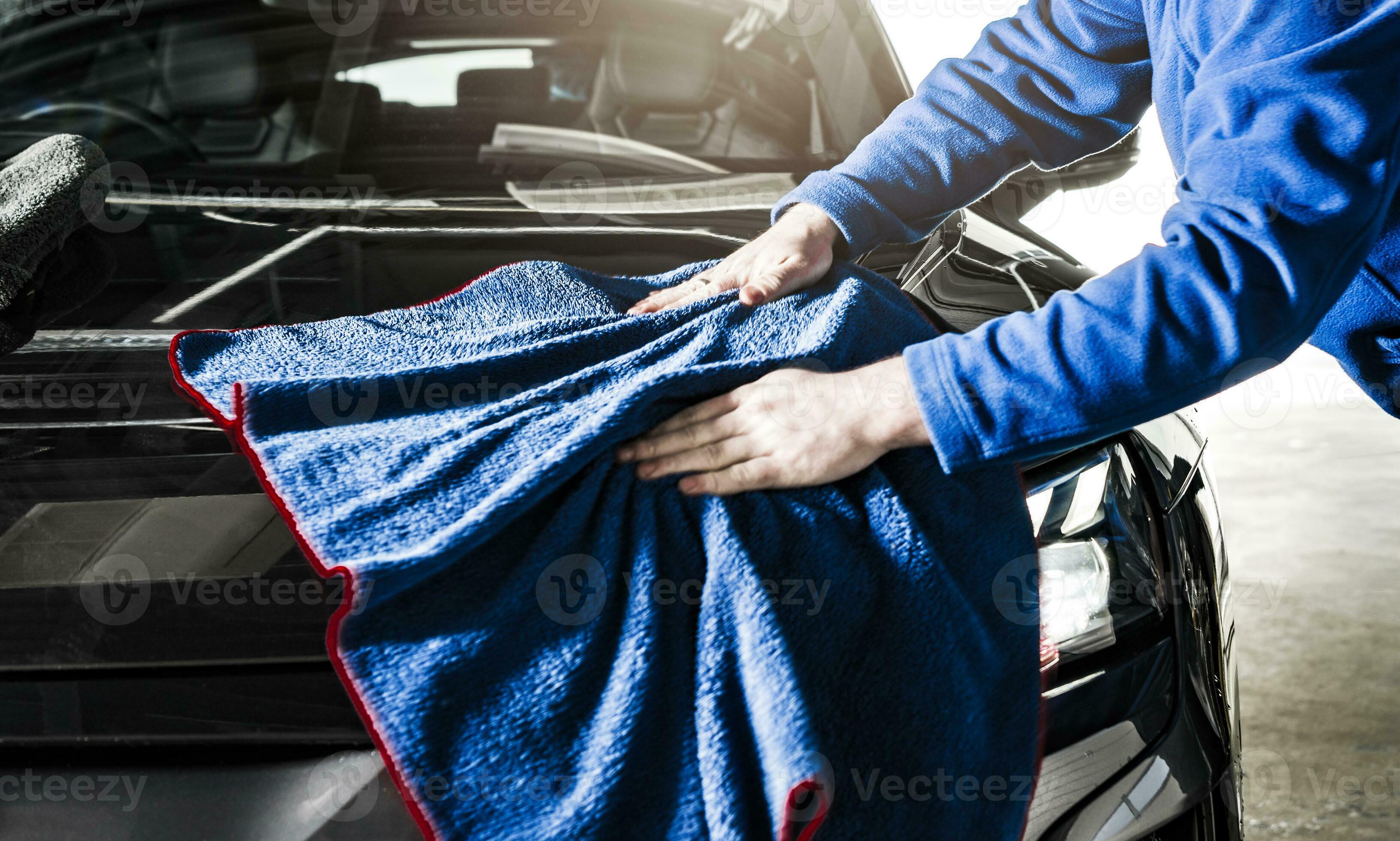 Car Detailer Cleaning Vehicle Body Using Soft Cloth 24626108 Stock