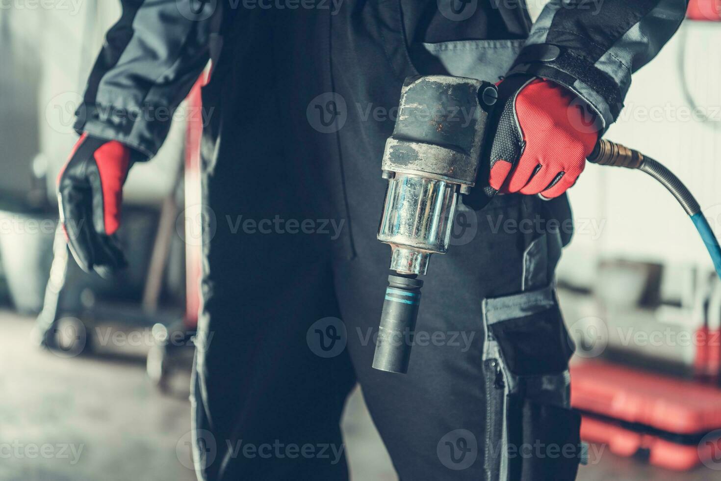 Mechanic with Pneumatic Gun photo