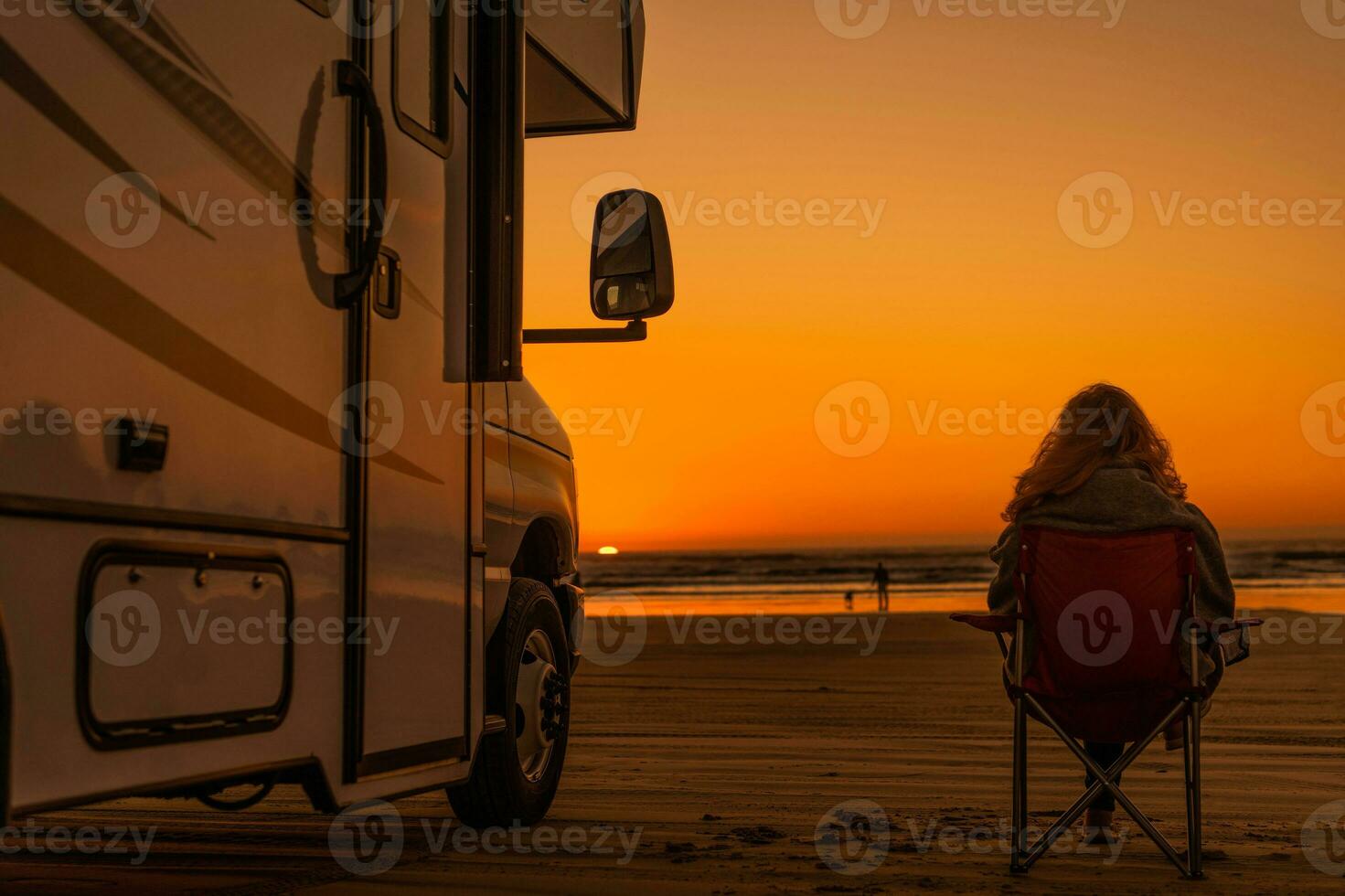 Family Relaxing on the Beach During Camper Traveling photo