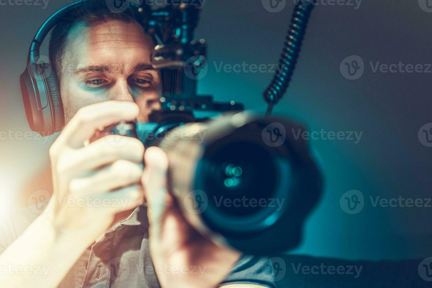 Video Camera Operator Taking Movie Shots photo