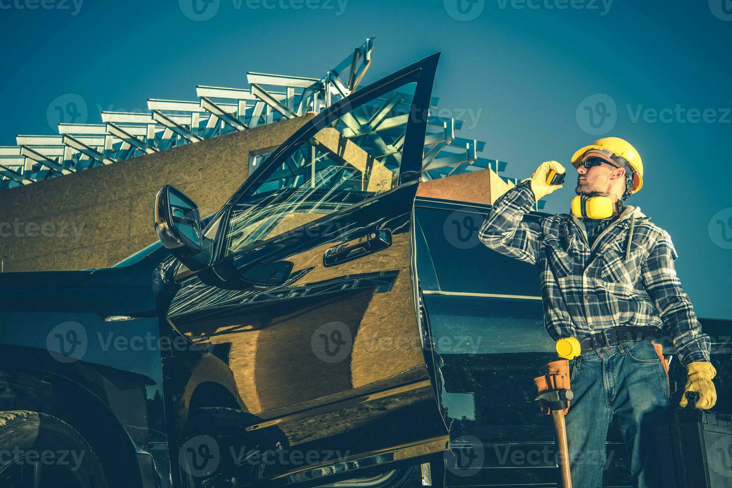 Construction Worker Talking On Radio. photo