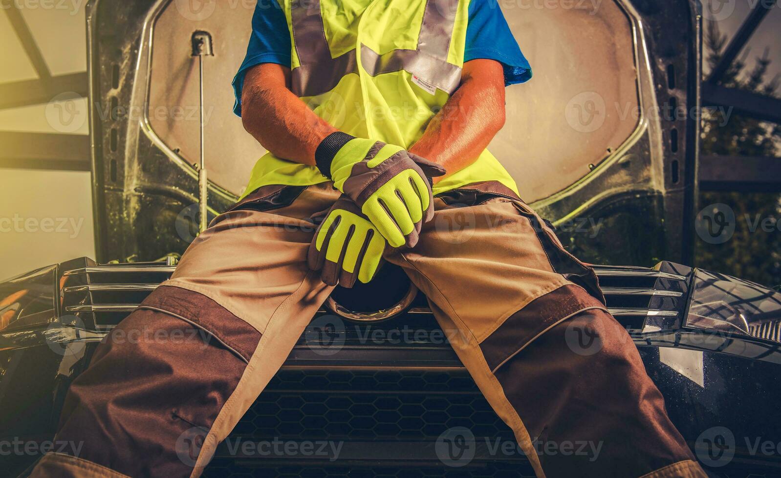 Mechanic man working on automobile photo