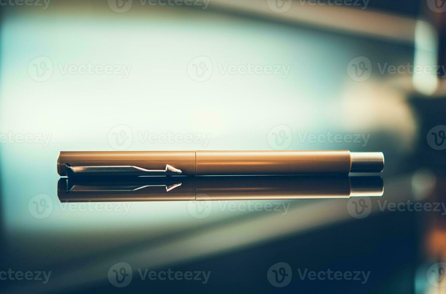 Elegant Pen on Glassy Desk photo