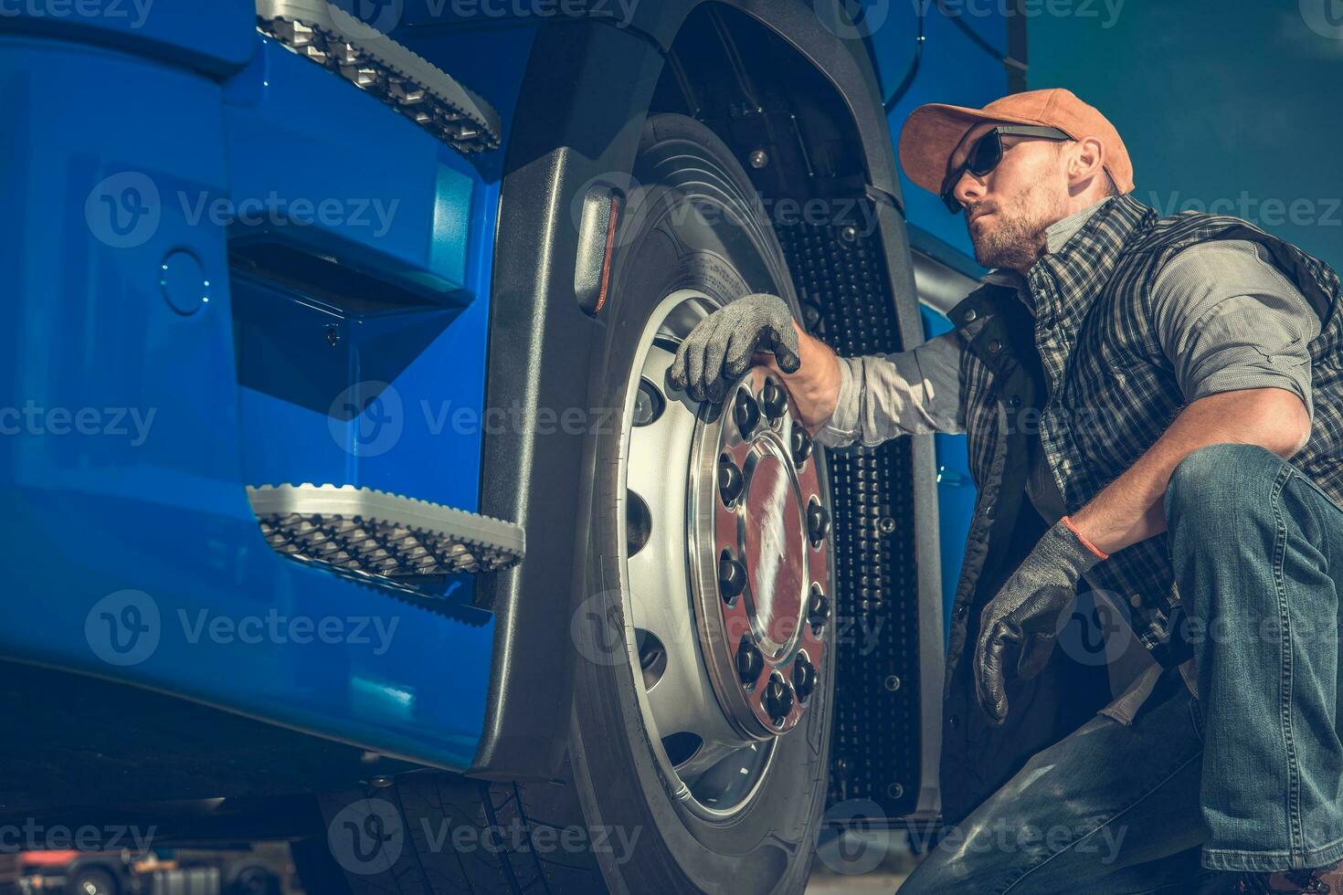 Truck Driver Checking Tires photo