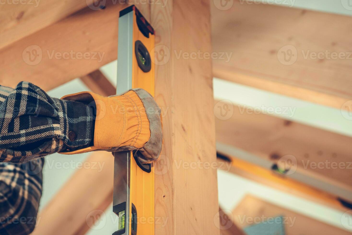 Construction Contractor Checking Home Frame Levels photo