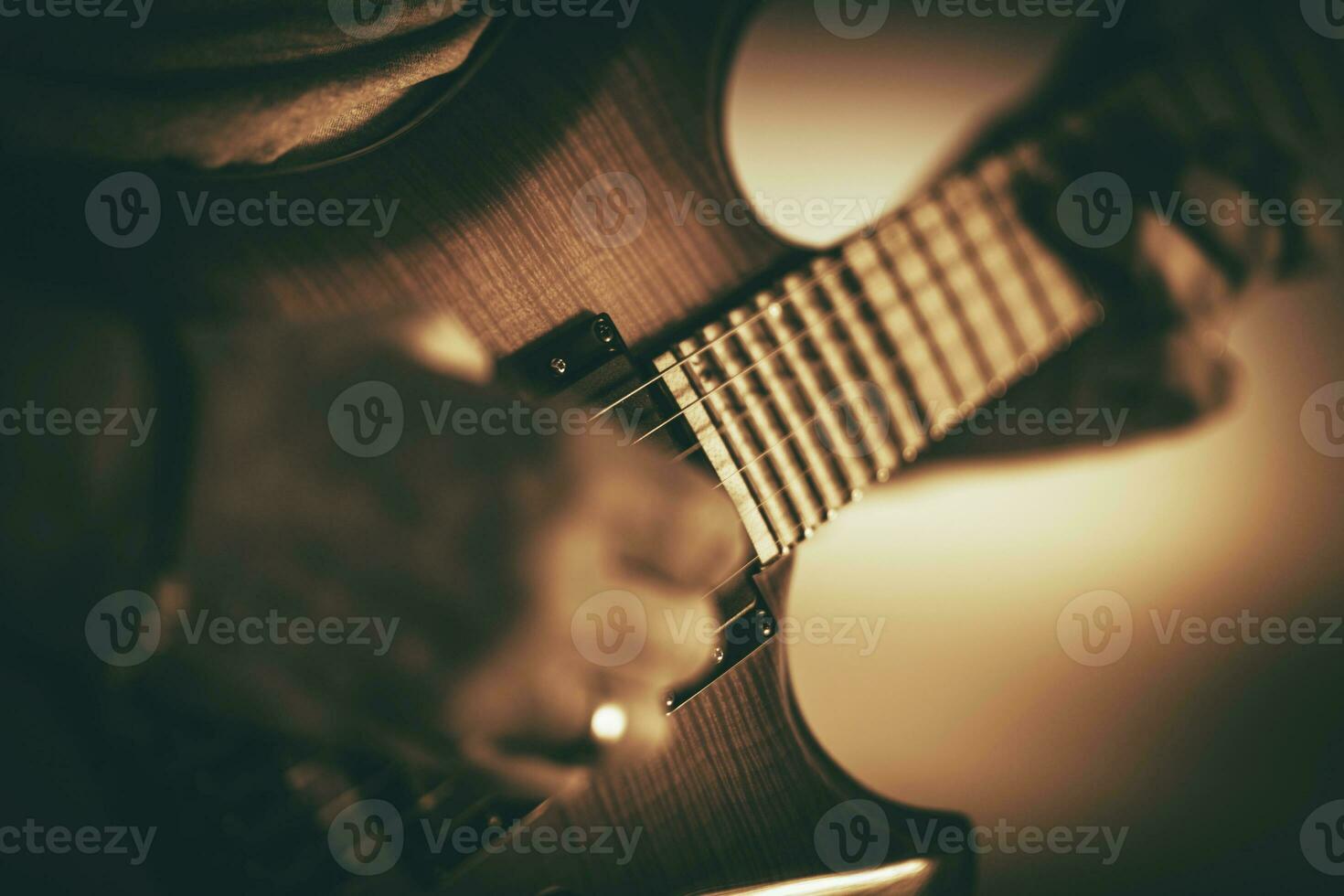 Caucasian Male Musician Playing Electric Guitar. photo