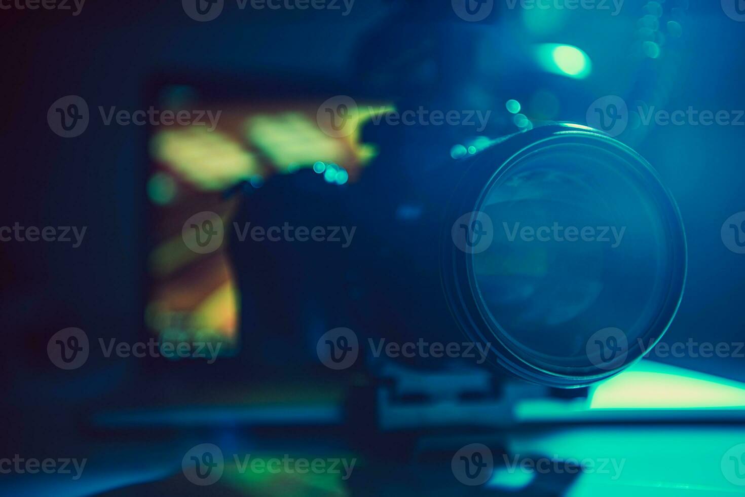 DSLR Video Camera with Telephoto Lens Attached photo