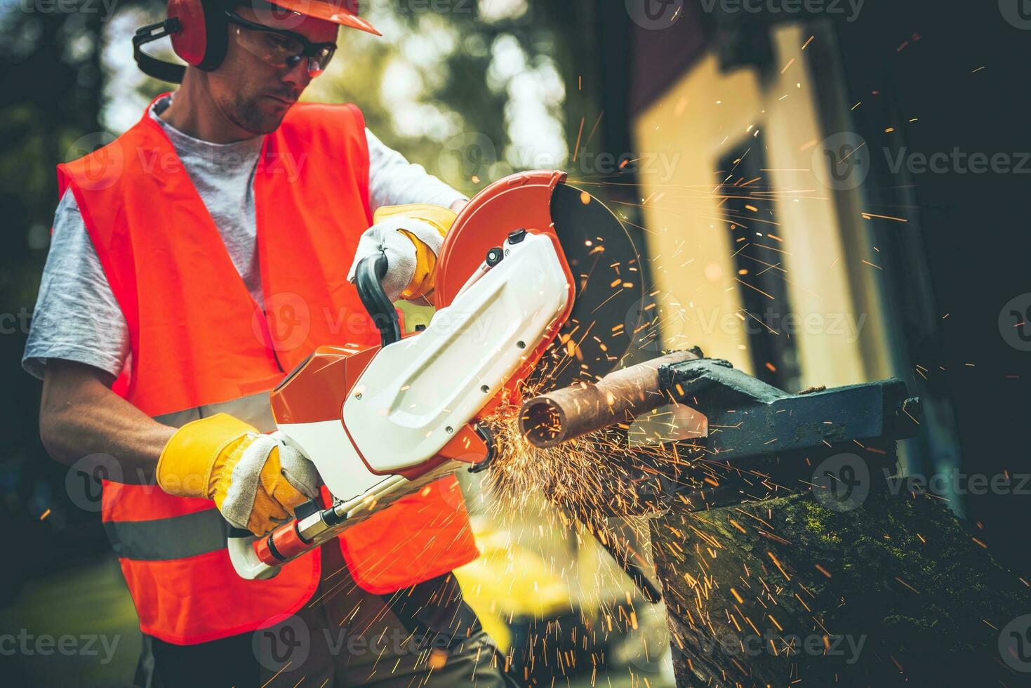 Men Using Metal Cutter photo