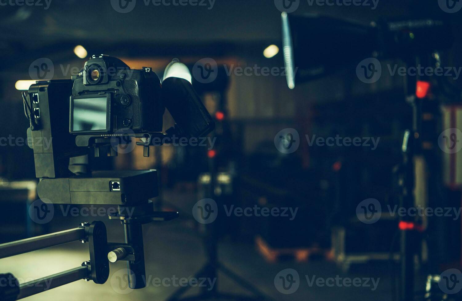 Digital Video Camera Attached to Automatic Jib Arm Inside a Studio photo