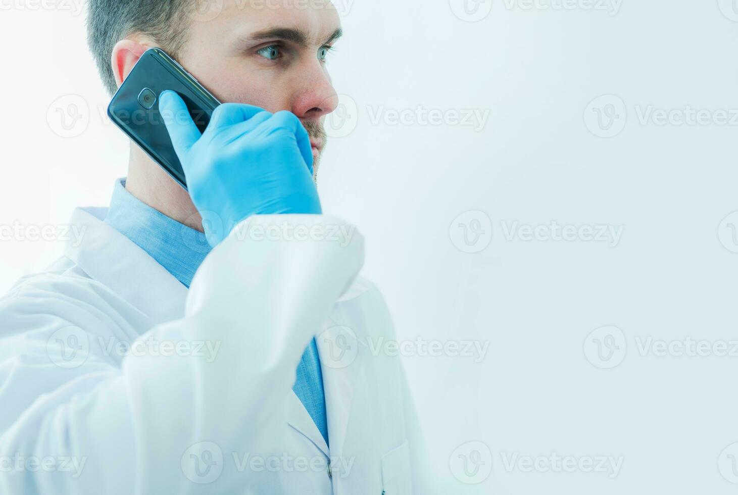 Medical Doctor Communicating On Cell Phone In Hospital. photo