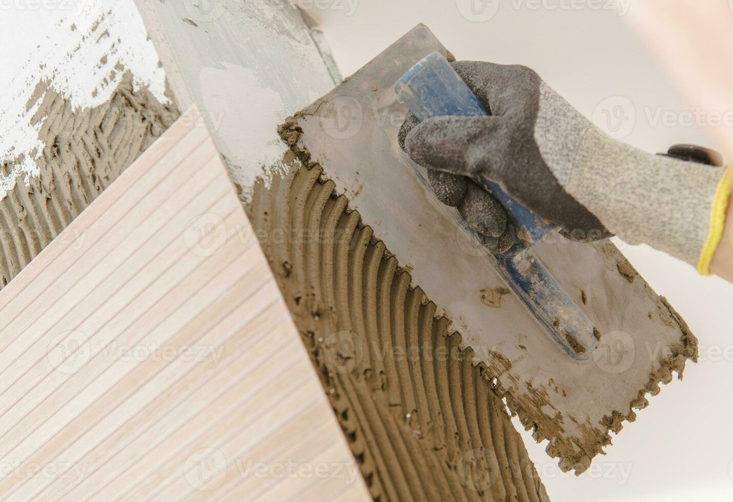 Men Installing Ceramic Tiles photo