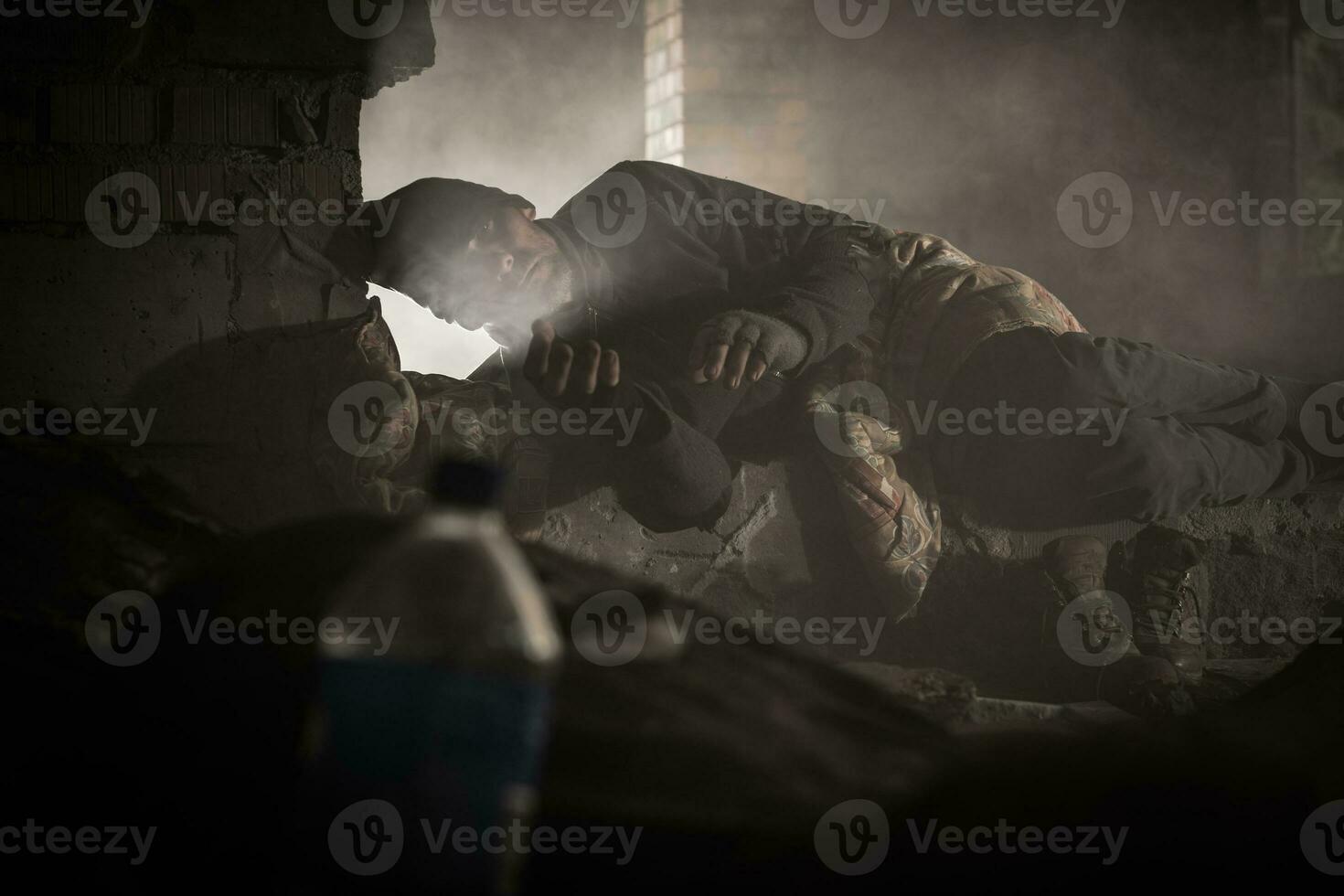 Homeless Men Sleeping Inside House Ruins photo