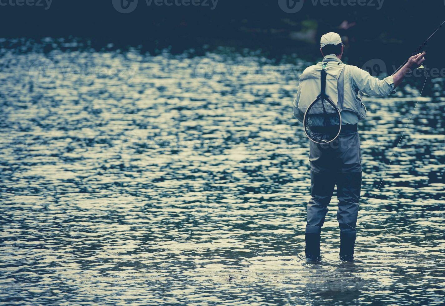 Fisherman Fishing in the Lake photo