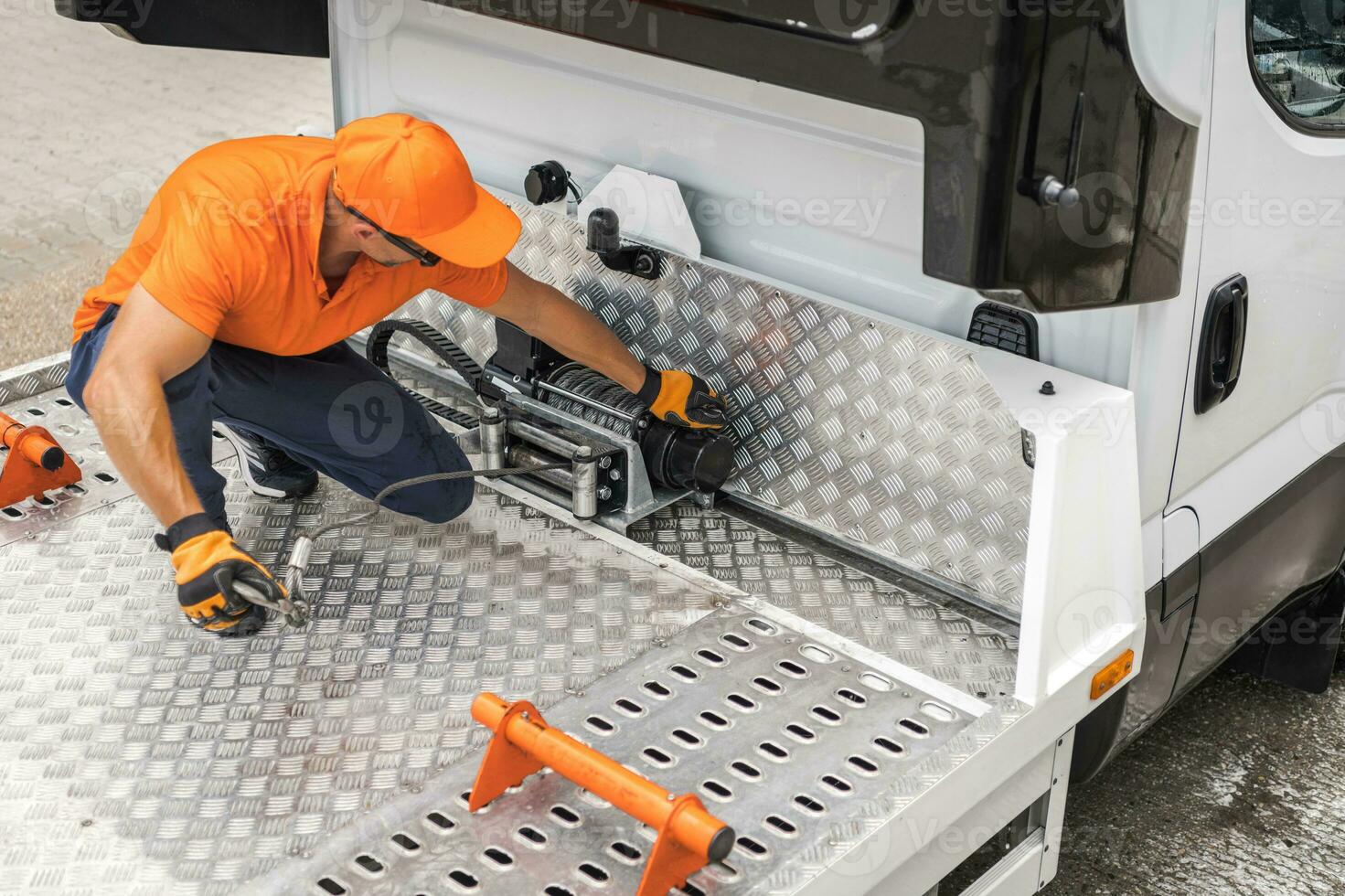 men-preparing-towing-truck-for-repossession-work-photo.jpg