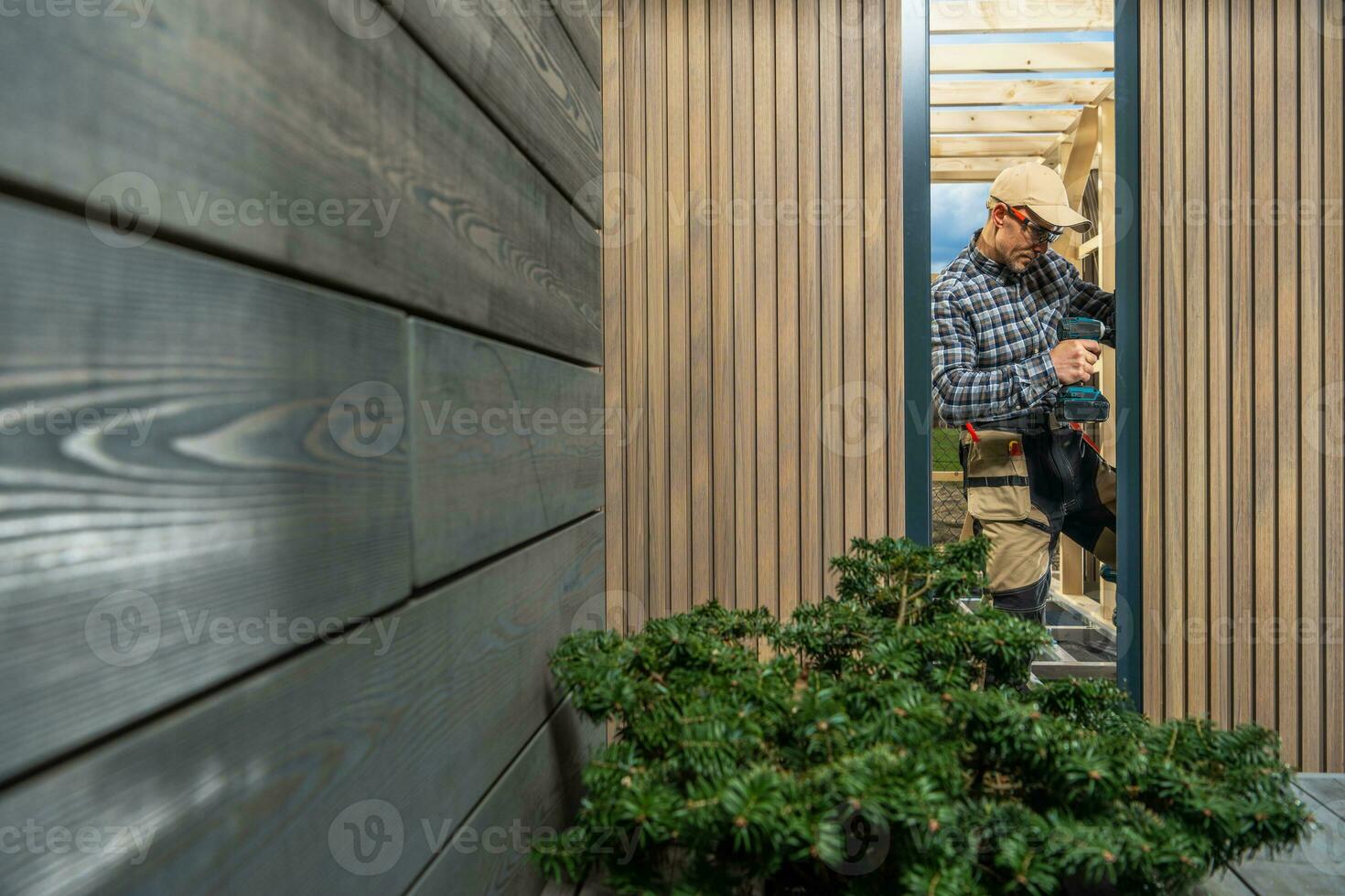 Modern Custom Garden Shed Building Performed by Construction Worker photo