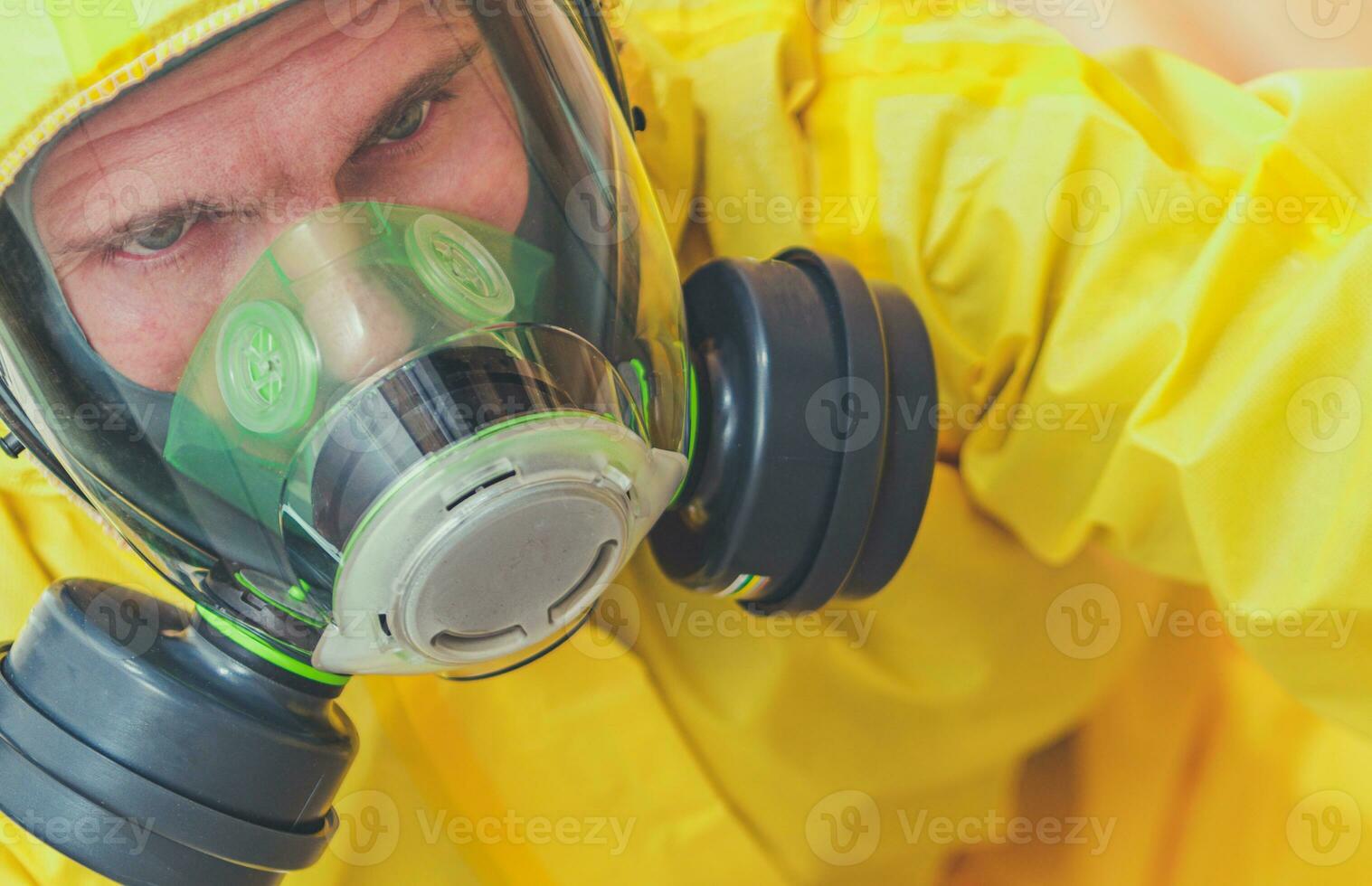 Tired Caucasian Worker in Hazmat Suit and Face Mask photo