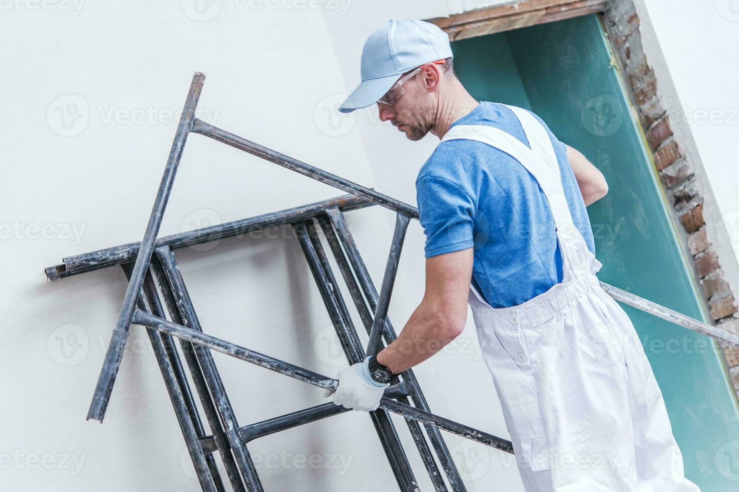 Worker Preparing Scaffolding photo