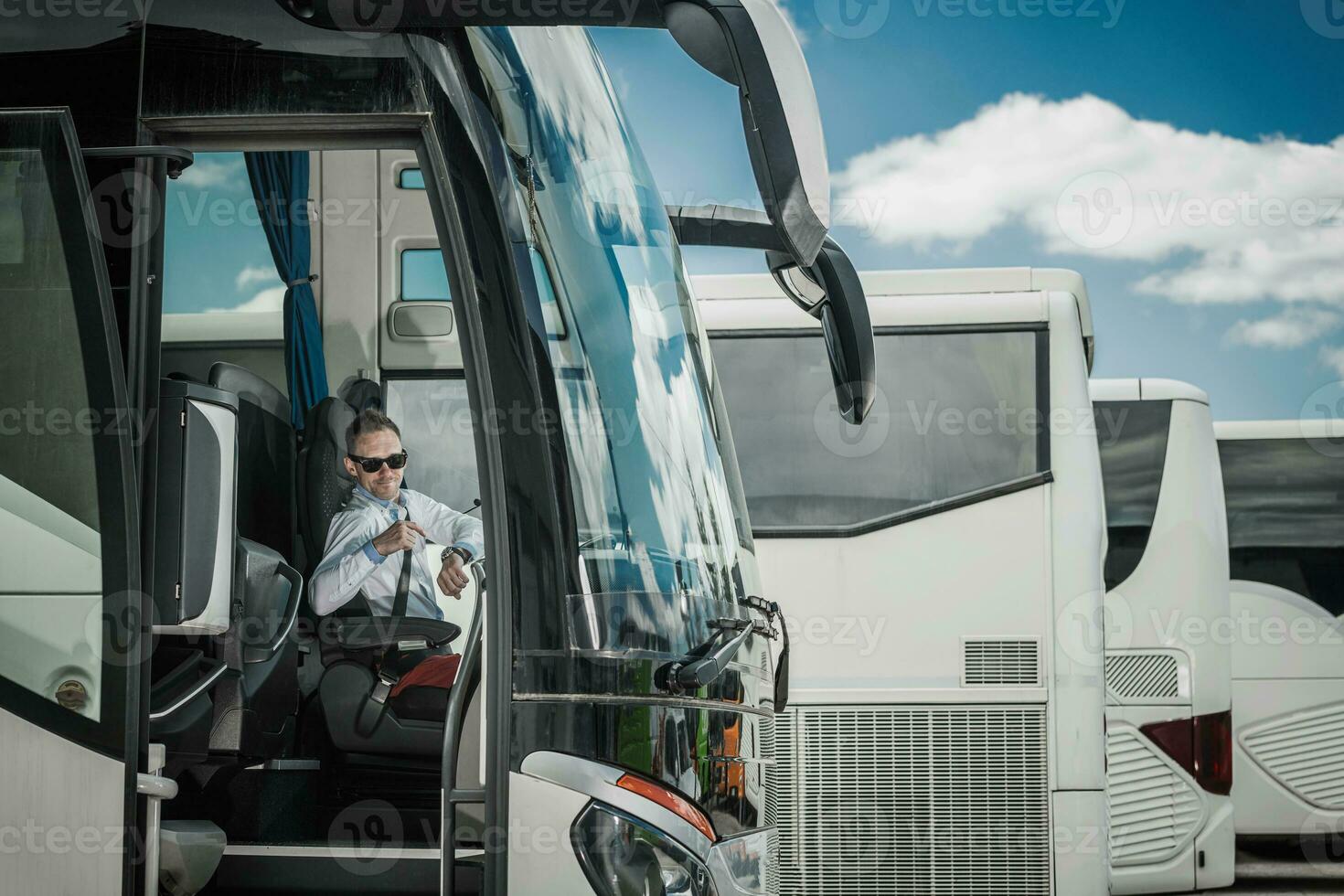 Bus Driver Pointing At Wrist Watch. photo