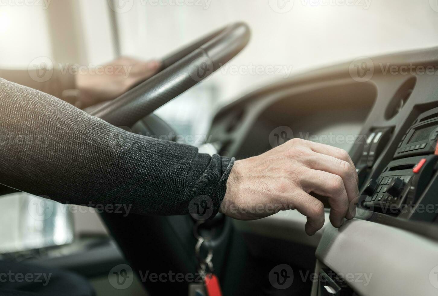 Coach Bus Driver Keeping Steering Wheel Close Up photo