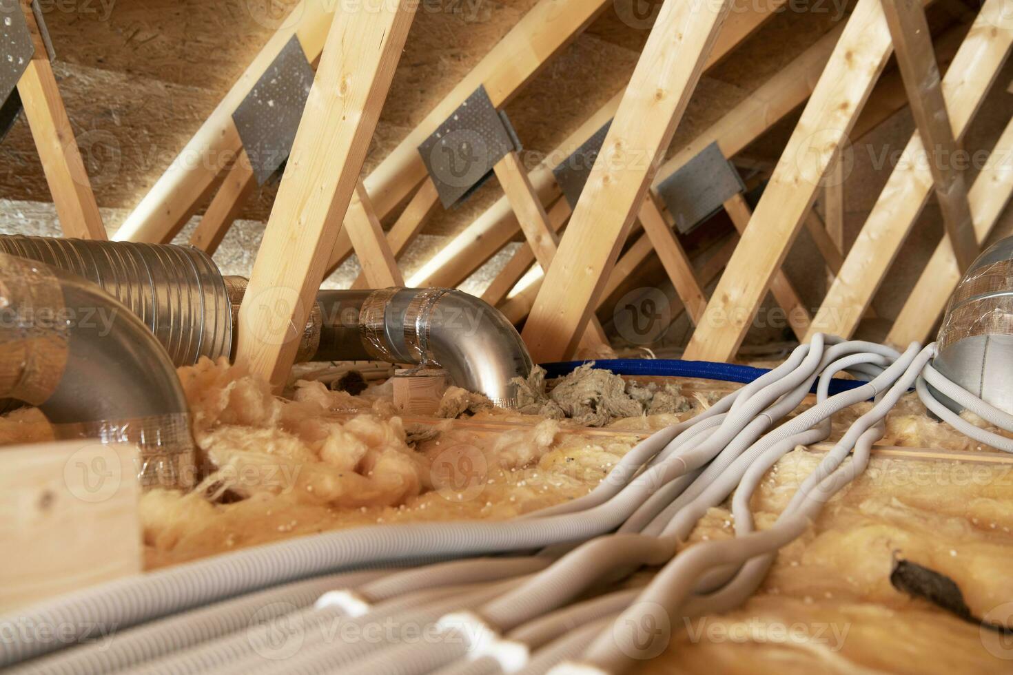 Residential Attic with Air Shafts and Electric Installations photo