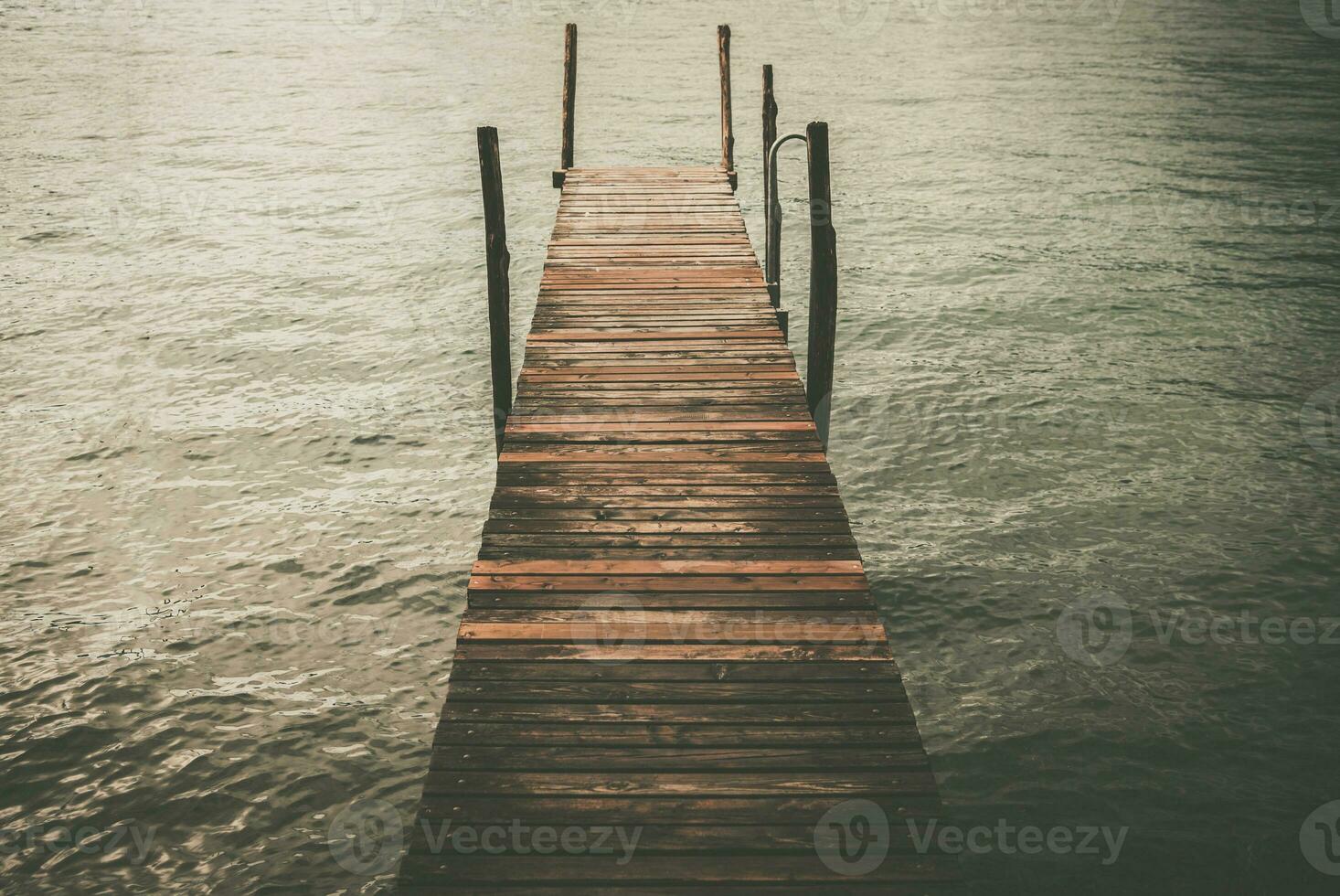 Rustic Wooden Pier on the Lake photo