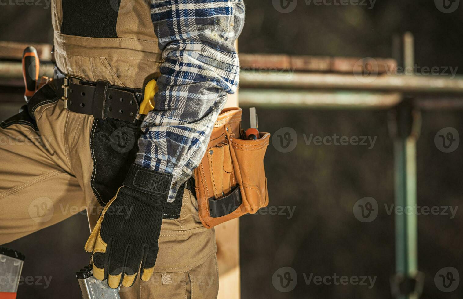 Close Up Of Construction Laborer With Tool Belt Around Waist. photo