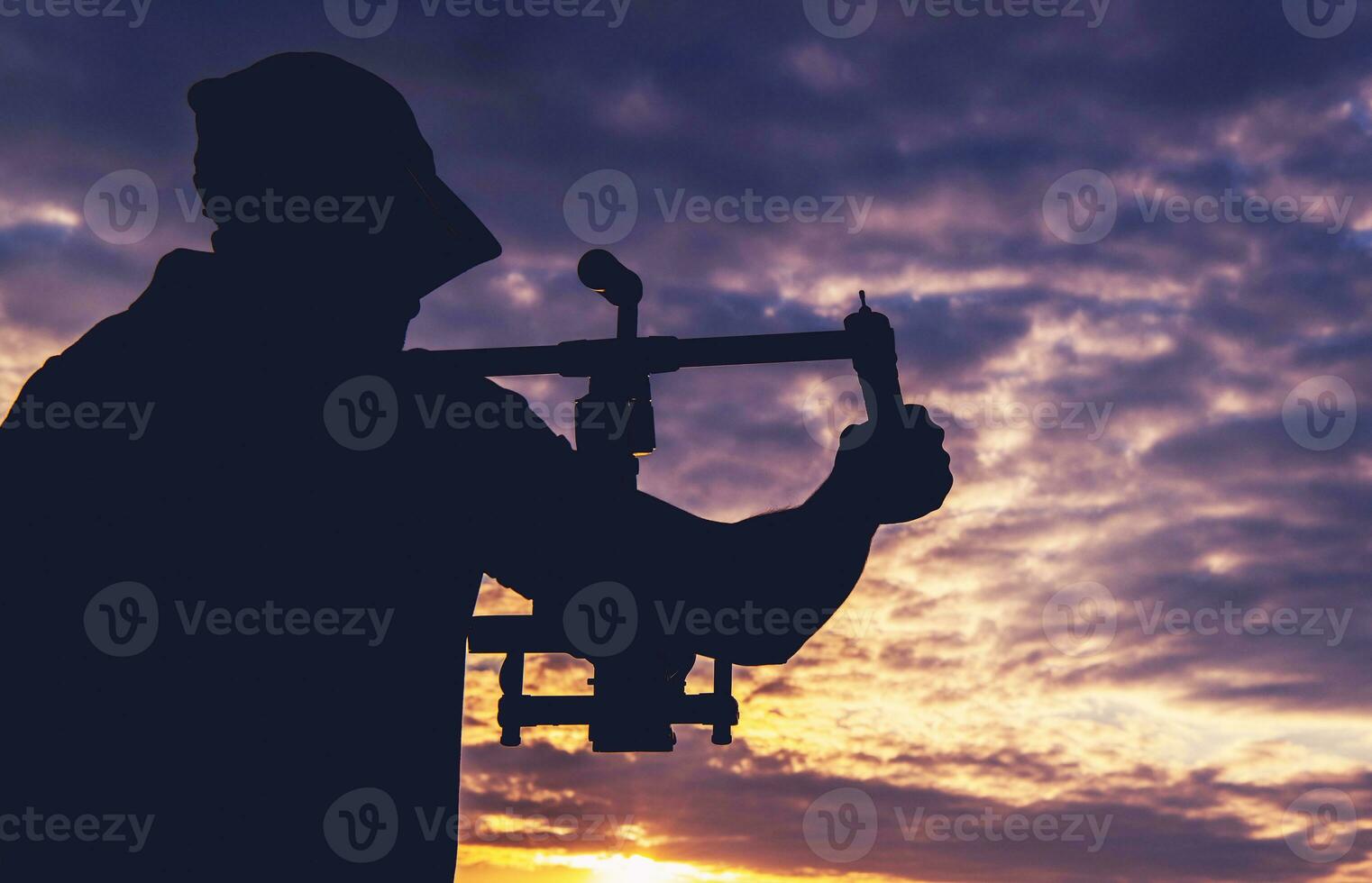 Male Camera Operator Taking Shot Using Gimbal Stabilizer photo