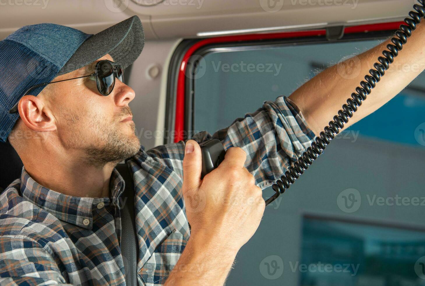 Semi Truck Driver Browsing CB Radio Channels photo