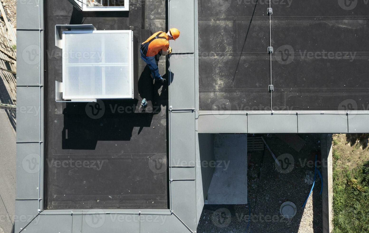 Lightning Protection Rod Installation on Top of a Building photo