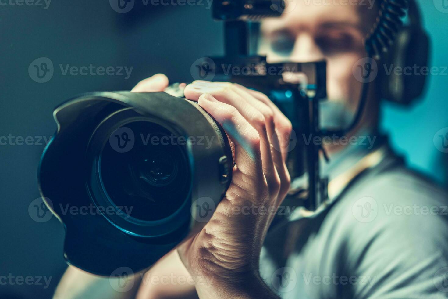 Amateur Movie Maker Shooting a New Film with His Video Camera photo