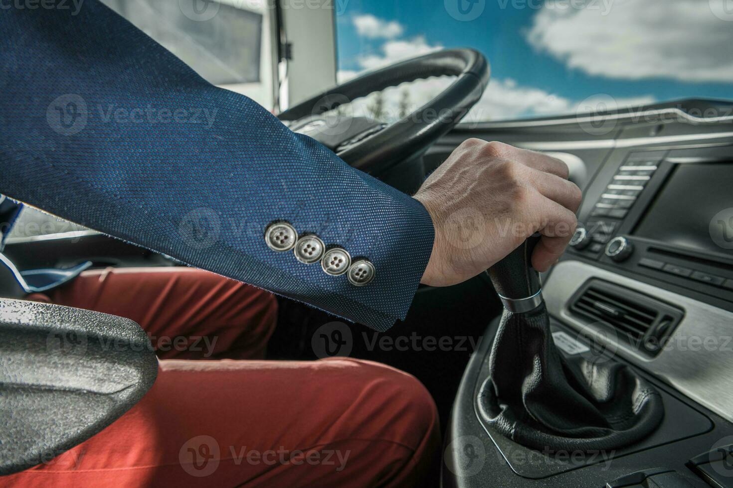 Bus Driver Behind Coach Steering Wheel photo