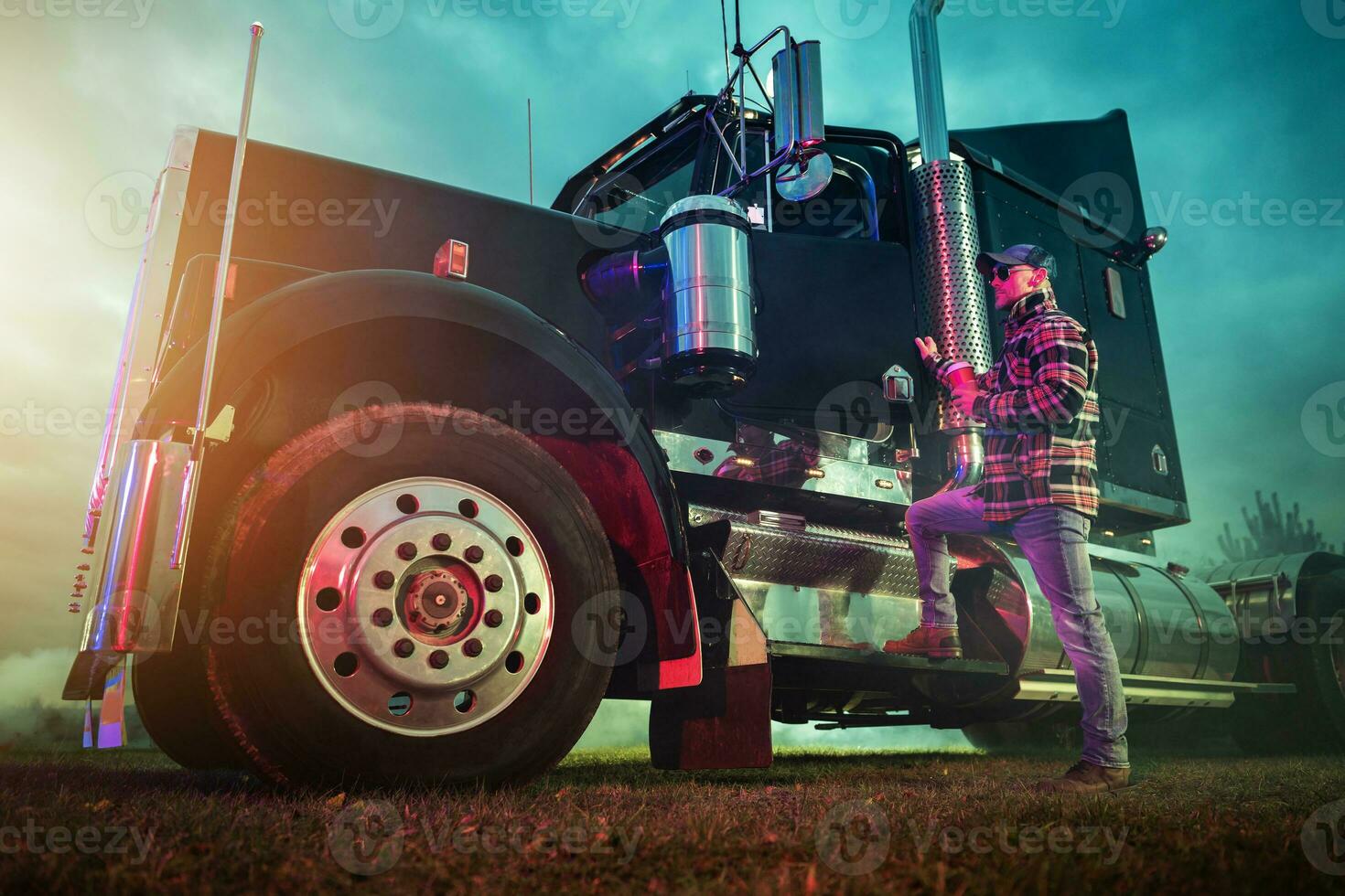 Professional Trucker Getting Inside His American Semi Tractor photo